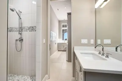 a bathroom with a shower and a sink at Soleil at Seagrove in Santa Rosa Beach