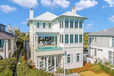 an aerial view of a large white house with a swimming pool at Soleil at Seagrove in Santa Rosa Beach