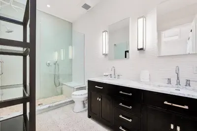 a bathroom with a sink and a toilet and a shower at St. Ivory in Rosemary Beach