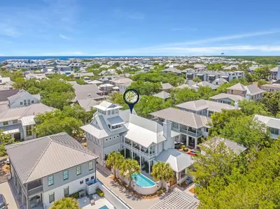 an overhead view of a building with a clock on it at St. Ivory in Rosemary Beach