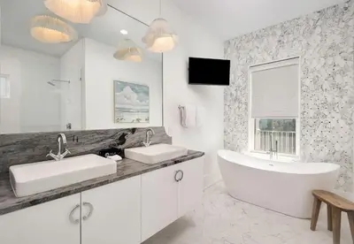 a white bathroom with two sinks and a tub at Coastal Dream in Santa Rosa Beach