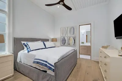 a bedroom with a bed and a ceiling fan at Gulf Front Sanctuary in Santa Rosa Beach
