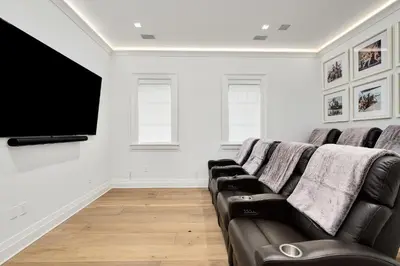 a living room with a couch and a flat screen tv at Gulf Front Sanctuary in Santa Rosa Beach