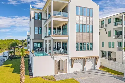 an apartment building with a view of the ocean at Emerald Le Luxe in Inlet Beach