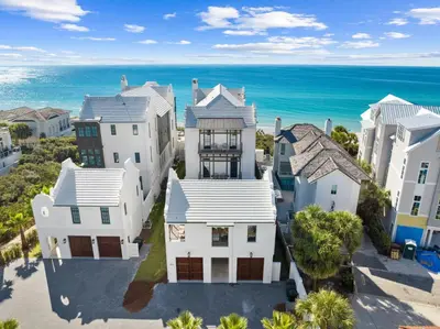 an aerial view of a house in front of the ocean at Villa Grandeur in Santa Rosa Beach