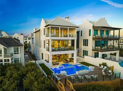 an aerial view of a house with a swimming pool at Villa Grandeur in Santa Rosa Beach