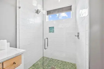 a bathroom with a shower with a glass door at Seven Palms Reunion in Inlet Beach