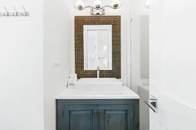 a bathroom with a sink and a mirror at Seven Palms Retreat in Inlet Beach