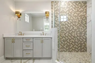 a white bathroom with a shower and a sink at Emerald View in Inlet Beach