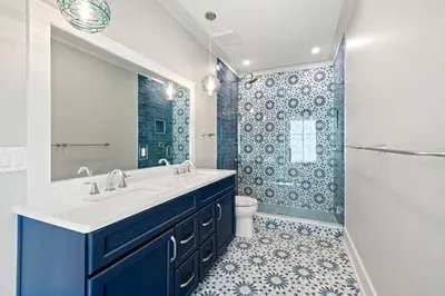 a bathroom with a sink and a toilet and a shower at Emerald View in Inlet Beach