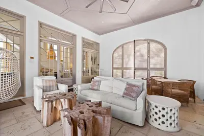 a living room with a couch and a table at Playa Blanca in Rosemary Beach