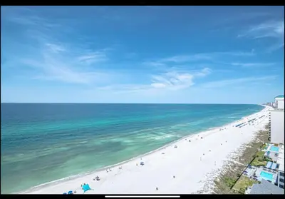 an aerial view of a beach with people on it at Dancing Dolphins, Watercrest 1803,1804 in Panama City Beach