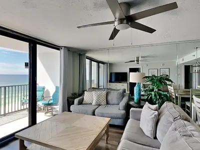 a living room with a couch and a ceiling fan at One Seagrove Place #507 in Santa Rosa Beach