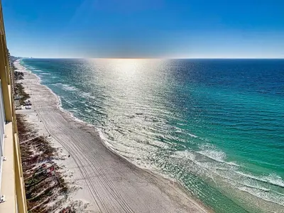 an aerial view of the beach and the ocean at Tropic Winds 2005 in Panama City Beach