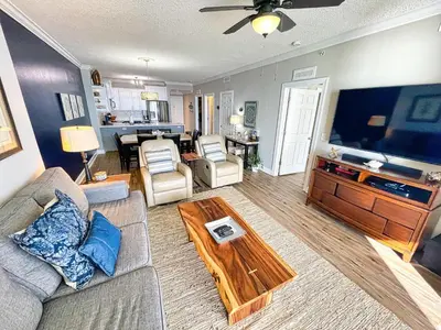 a living room with a couch and a table at Tropic Winds 2005 in Panama City Beach