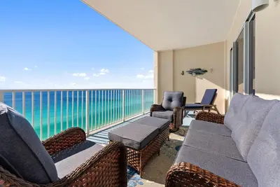 a living room with a view of the ocean at Ocean Reef 1904 in Panama City Beach