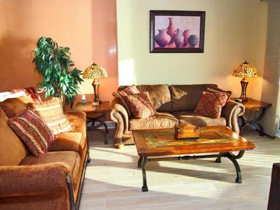 a living room with couches and a coffee table at Ocean Reef 1608 in Panama City Beach