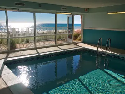 a swimming pool with a view of the ocean at Ocean Reef 1202 in Panama City Beach