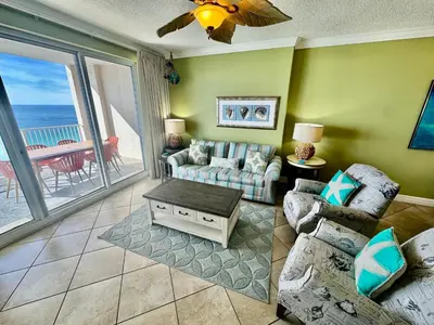 a living room with a couch and a table at Ocean Reef 1707 in Panama City Beach