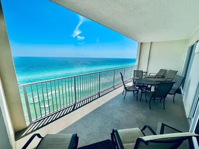 a balcony with a table and chairs and the ocean at Ocean Reef 2001 in Panama City Beach