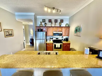 a kitchen with a large counter top in a room at Ocean Reef 2001 in Panama City Beach