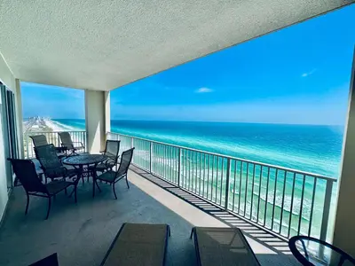 a balcony with a table and chairs and the ocean at Ocean Reef 2001 in Panama City Beach