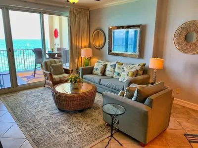 a living room with a couch and a table at Ocean Reef 1403 in Panama City Beach