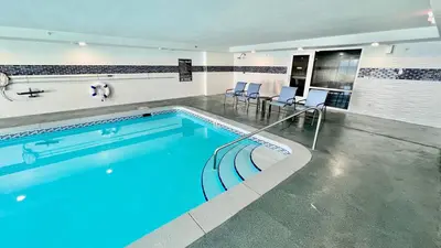a swimming pool with blue water in a building at Ocean Reef 1803 in Panama City Beach