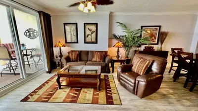 a living room with a couch and a coffee table at Ocean Reef 1803 in Panama City Beach