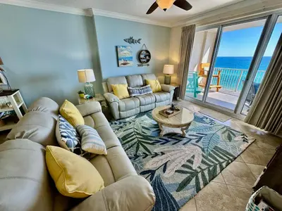a living room with a couch and a table at Ocean Reef 1102 in Panama City Beach