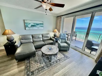 a living room with a couch and a table at Ocean Reef 606 in Panama City Beach