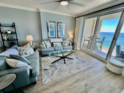 a living room with a couch and a table at Ocean Reef 1006 in Panama City Beach