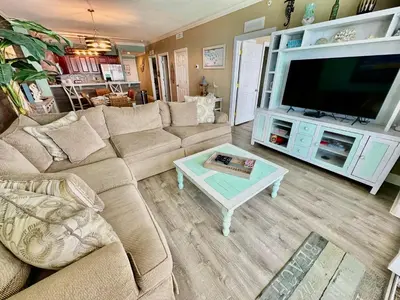 a living room with a couch and a coffee table at Tropic Winds 2209 in Panama City Beach