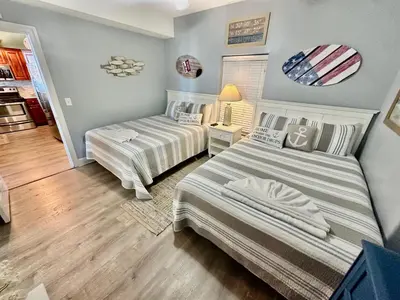 a bedroom with two beds in a room at Tropic Winds 2209 in Panama City Beach