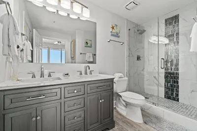 a bathroom with a sink and a toilet and a shower at Tropic Winds 1901 in Panama City Beach