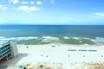 a view of the beach from the balcony of a resort at Ocean Reef 1101 in Panama City Beach