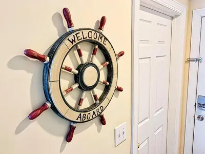 a welcome aboard wall clock hanging on a wall at Tropic Winds 801 in Panama City Beach