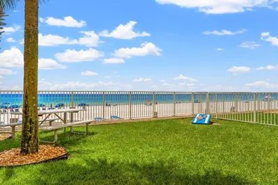a view of the beach from the balcony of a condo at Tropic Winds 801 in Panama City Beach