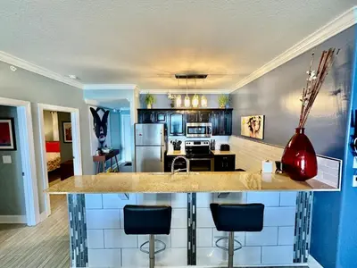 a kitchen with a large island in the middle at Ocean Reef 604 in Panama City Beach