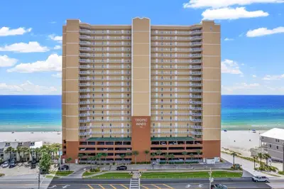 a large building with the ocean in the background at Tropic Winds 703 in Panama City Beach