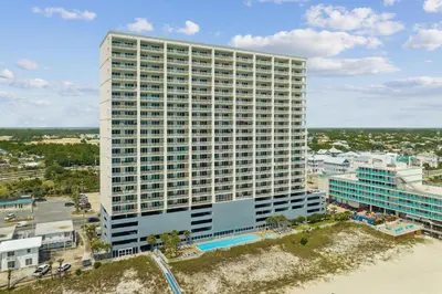 an aerial view of a tall building with a pool at Ocean Reef 1308 in Panama City Beach