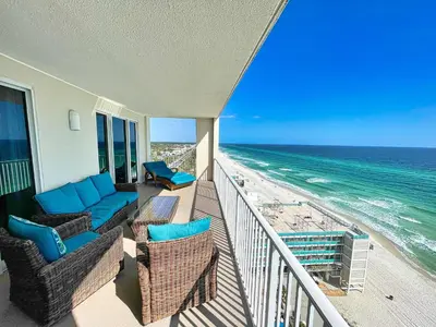a balcony of a house with chairs and the ocean at Ocean Reef 1401 in Panama City Beach