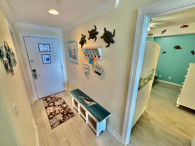 a childs room with a room with a crib and a room with a room at Ocean Reef 1007 in Panama City Beach