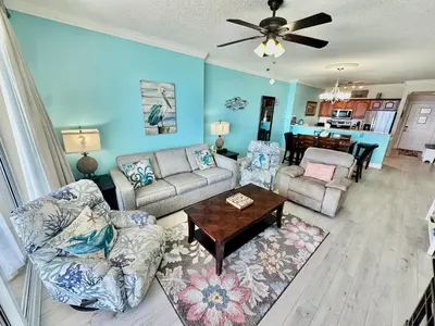 a living room with a couch and a table at Ocean Reef 1007 in Panama City Beach