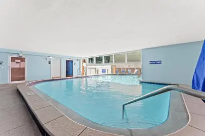 a large swimming pool in a building at Tropic Winds 603 in Panama City Beach