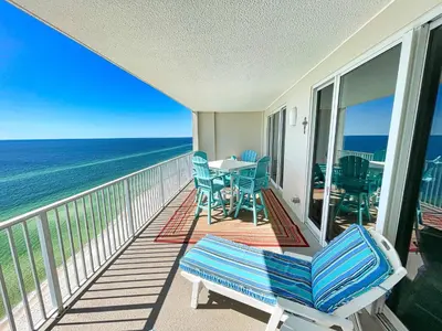 a balcony with a table and chairs and the ocean at Ocean Reef 1808 in Panama City Beach