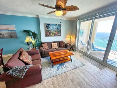 a living room with a couch and a table at Ocean Reef 1808 in Panama City Beach