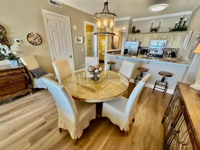 a dining room with a table and chairs at Ocean Reef 2308 in Panama City Beach