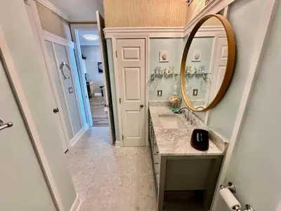 a bathroom with a sink and a mirror at Ocean Reef 2308 in Panama City Beach