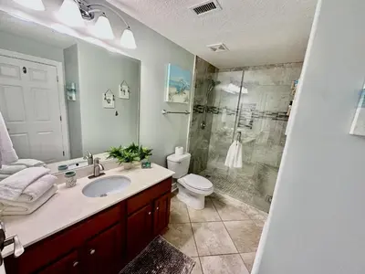 a bathroom with a sink and a shower and a toilet at Ocean Reef 802 in Panama City Beach